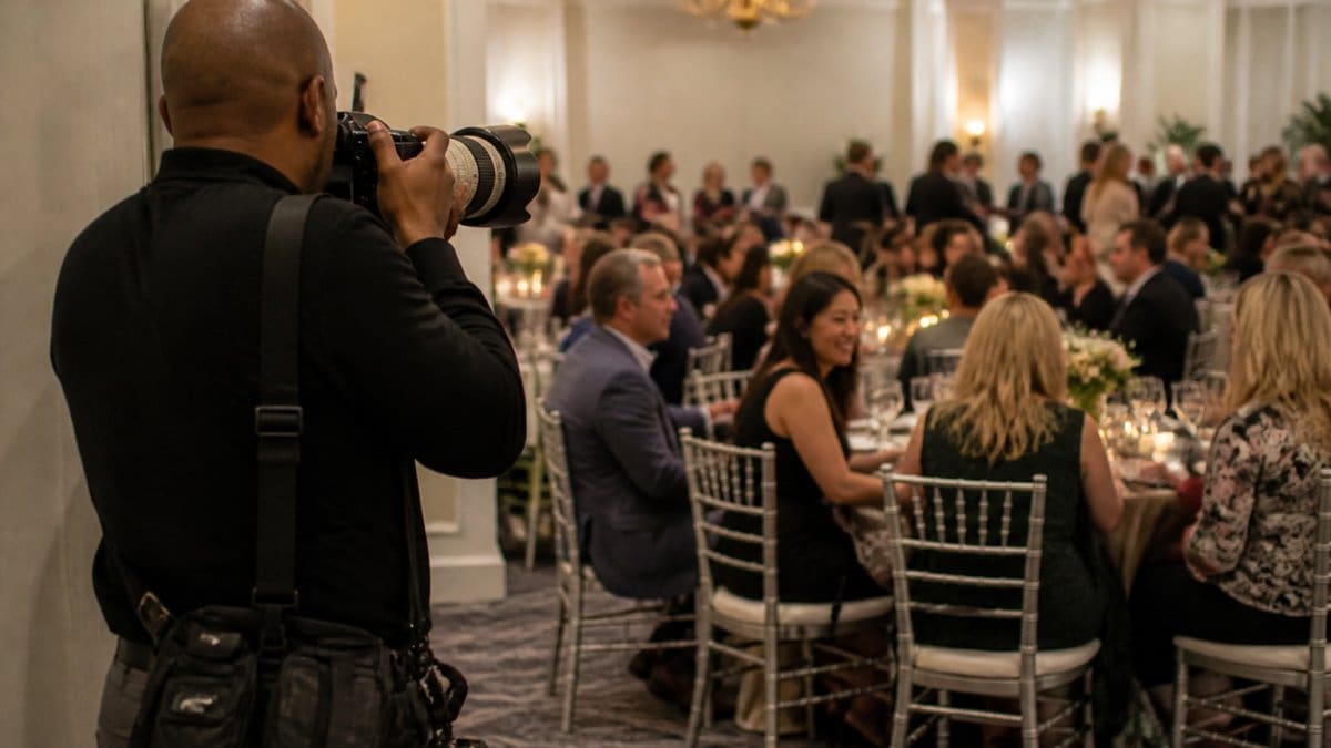 Process diagram illustrating how a photographer captures candid nonprofit event moments from the sidelines.